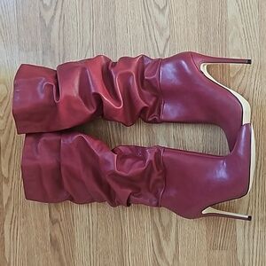 Knee high stiletto heel boots